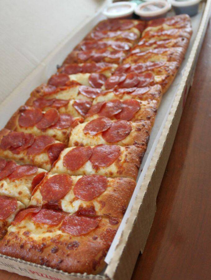 The New Pizza Hut Big Flavor Dippers Pizza is perfect for a party, game day, or a summer get together. TOne huge pizza that comes with 4 dipping sauces!